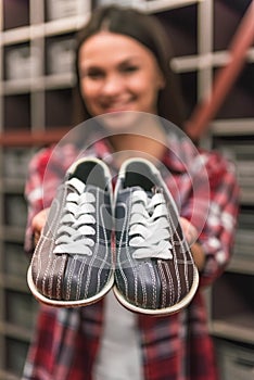 Girl with bowling shoes