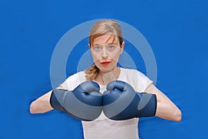 Girl boxer in blue arena