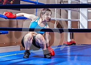 Girl boxer in boxing ring