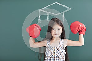 girl with boxing gloves and graduation concept