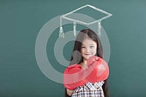 girl with boxing gloves and graduation concept