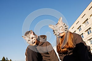 girl and boy in cat masks doing Quadrobics in the city, animal behavior simulation, Quadrobics sport photo