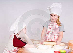 Girl and boy in chef's hats