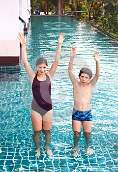 Girl and boy competition swimming pool