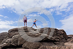 Girl Boy Explore Beach Rocks Sky