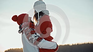 Girl and a boy having fun and laugh. Happy young couple dating in winter outside at Xmas, holidays concept. Family