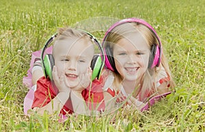 Girl with a boy in headphones listening to music