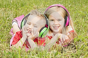 Girl with a boy in headphones listening to music