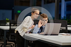 Girl and boy holding business video call