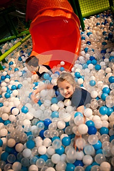 Girl and boy at indoor fun amusement park