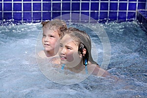 Girl and boy in jacuzzi