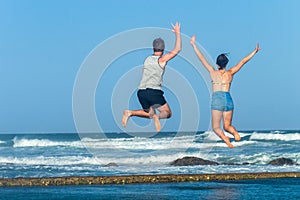Girl Boy Jump Leap Beach Ocean Tidal Pool