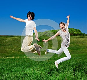 Girl and boy are jumping