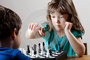 Girl and boy playing chess