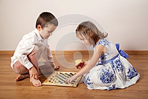 Girl and boy playing chess