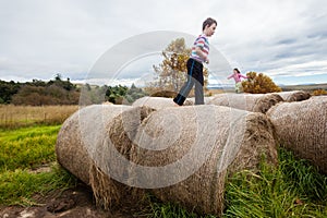 Girl Boy Playing Farm Bales