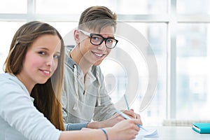 Girl and boy study together and help each