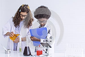 Girl and boy studying science at school