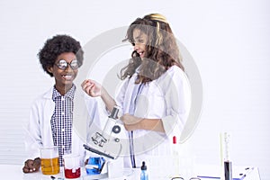 Girl and boy studying science at school