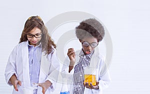 Girl and boy studying science at school