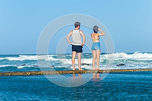 Girl Boy Watching Ocean Waves