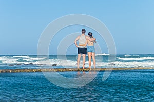 Girl Boy Watching Ocean Waves