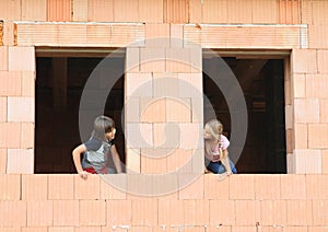 Girl and boy in the windows