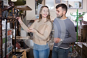 Girl with boyfriend buying hallstand