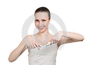 Girl with braces, tooth paste and brush