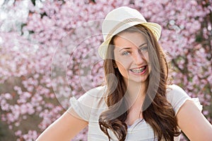 Girl with braces wearing hat romantic spring