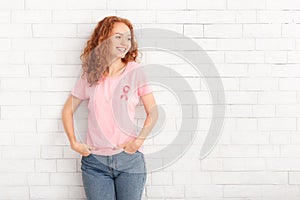 Girl In Breast Cancer T-Shirt Standing Over White Brick Wall