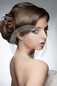 Girl with bridal hairstyle and makeup