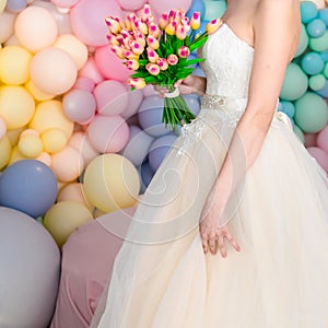 Girl-bride in a wedding dress with an object in her hands