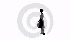 Girl with a briefcase looking at the clock silhouette