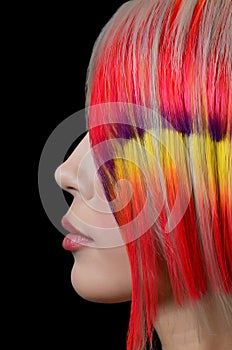 Girl with bright make-up and multi-coloured hair