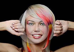 Girl with a bright make-up and multi-coloured strand in hair