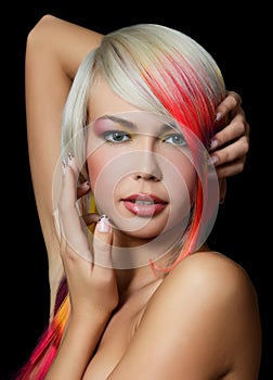 Girl with a bright make-up and multi-coloured strand in hair