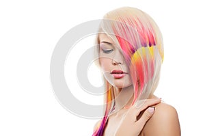 Girl with a bright make-up and multi-coloured strand in hair