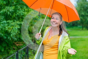 Girl with a bright orange umbrella