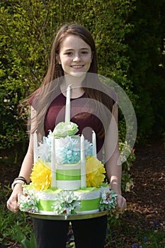 Girl brings birthday cake made of toilet paper photo