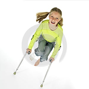 Girl with a broken leg jumping on crutches