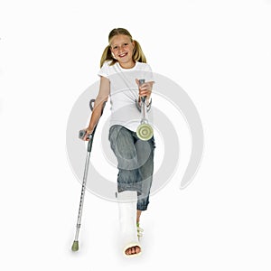 Girl with a broken leg walking on crutches