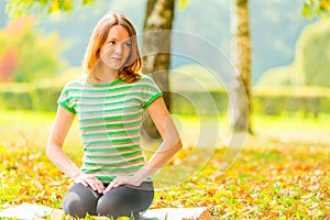 Girl with brown eyes resting on the grass