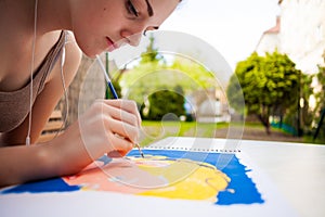 Girl with brush painting an art image