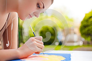 Girl with brush painting an art image