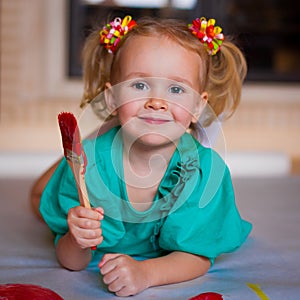 Girl with brush paints