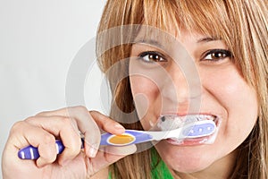Girl brushing her teeth