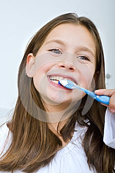 Girl brushing her teeth