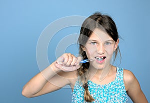 Girl brushing teeth