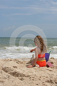 Girl building sand castle 1